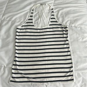 Black and White tank top L but runs small. It was worn only 1 time